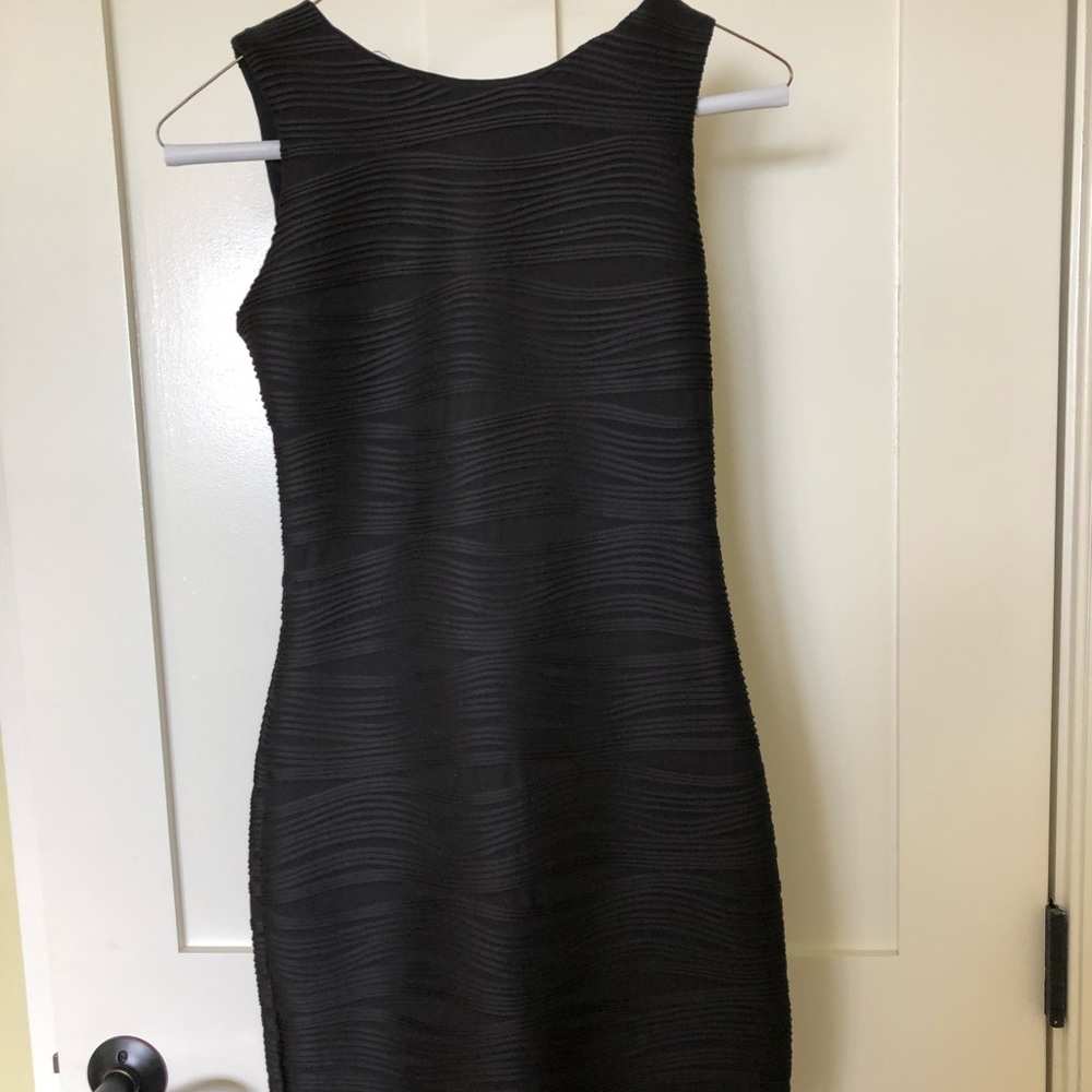 Tight black mini dress with ribs